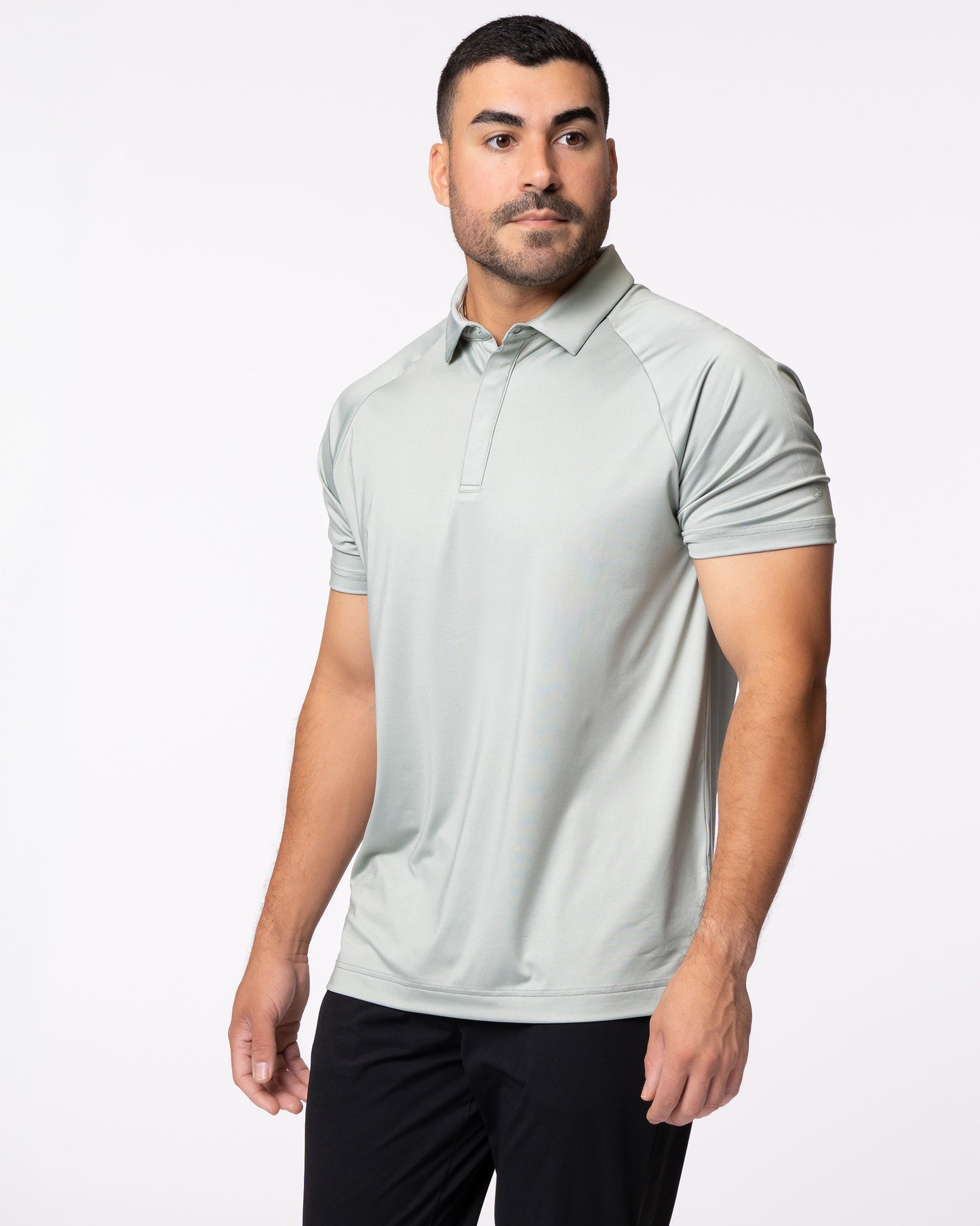Man wearing green golf polo
