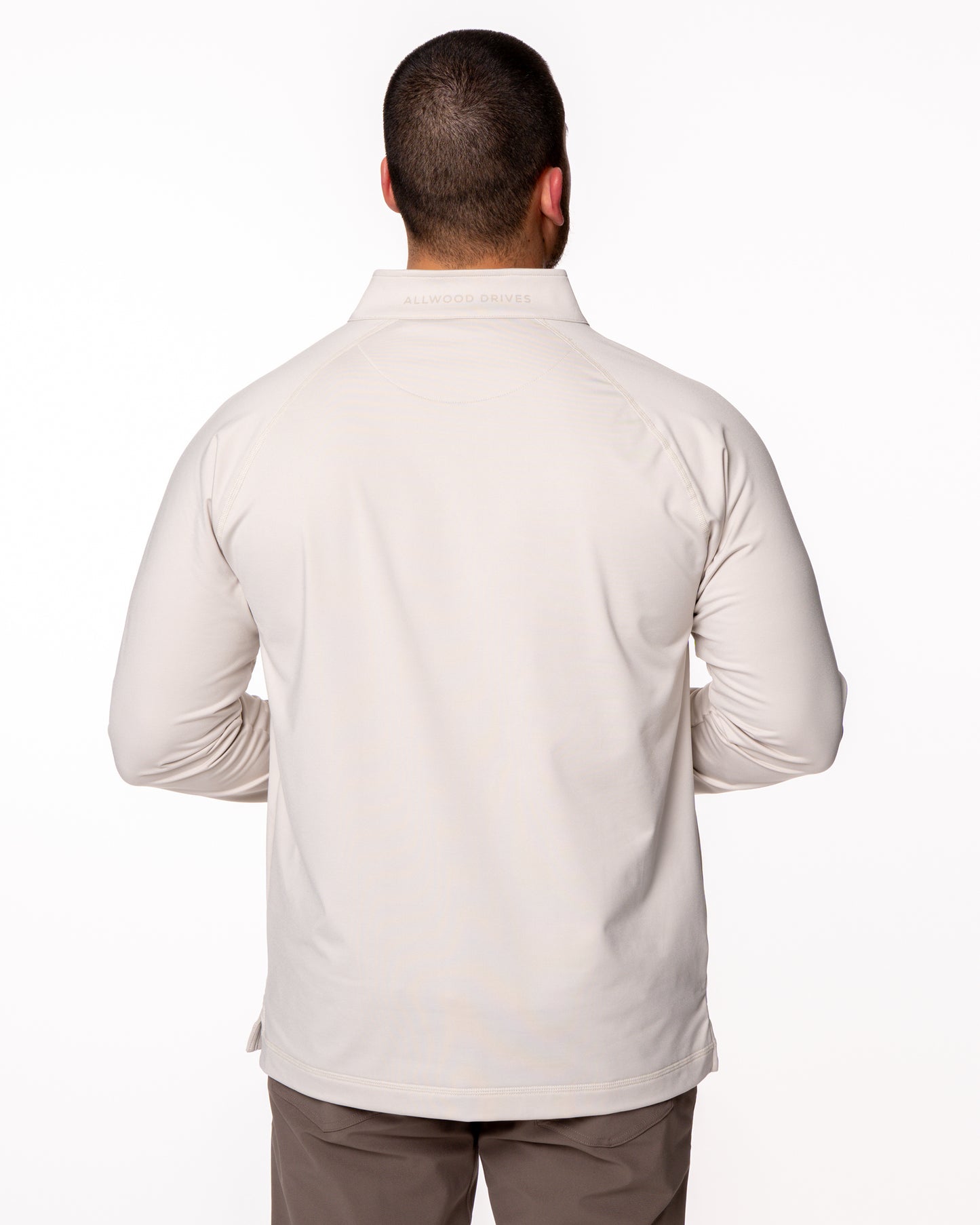 Model showing back of beige quarter zip shirt