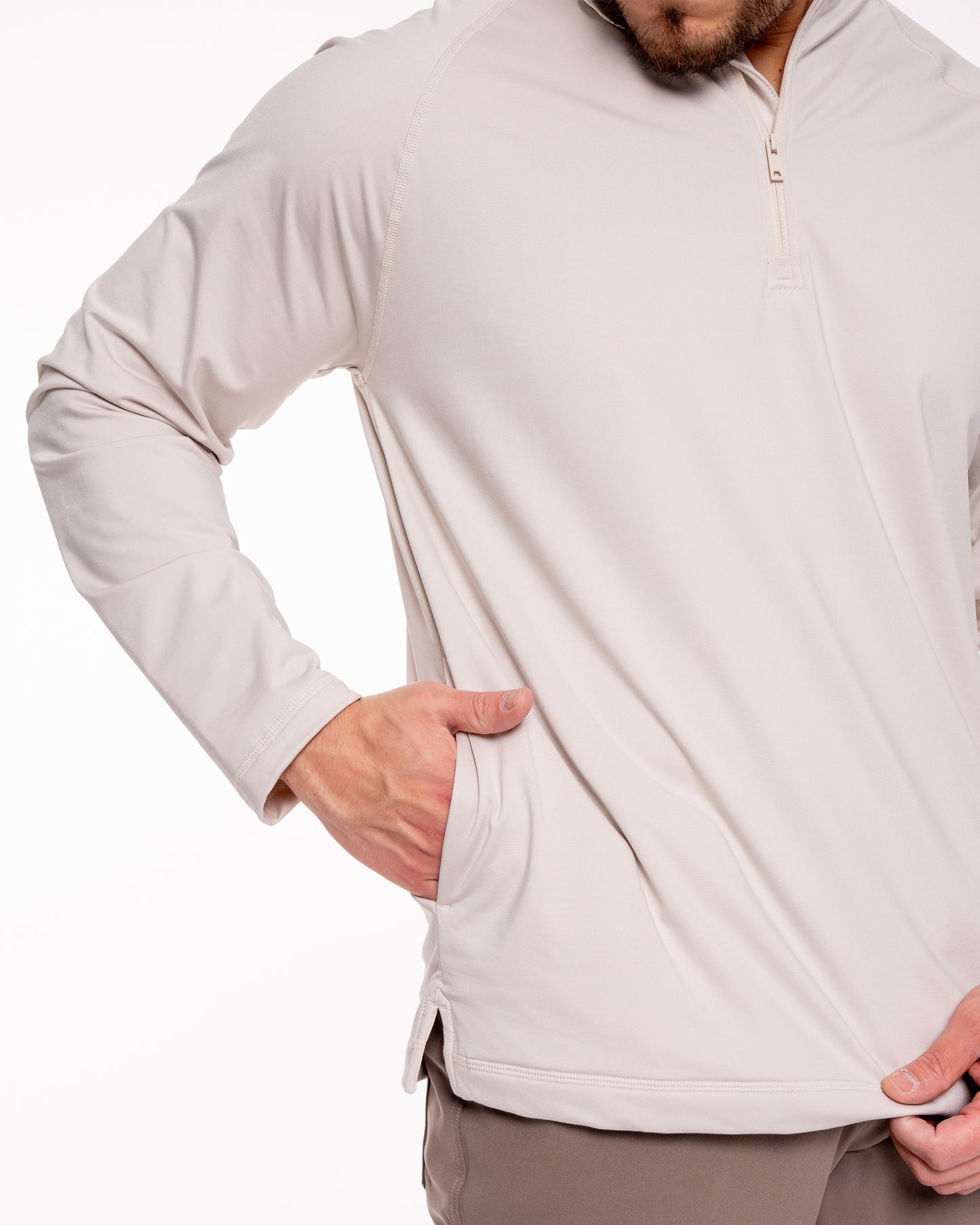 Man putting hand in quarter zip shirt pocket