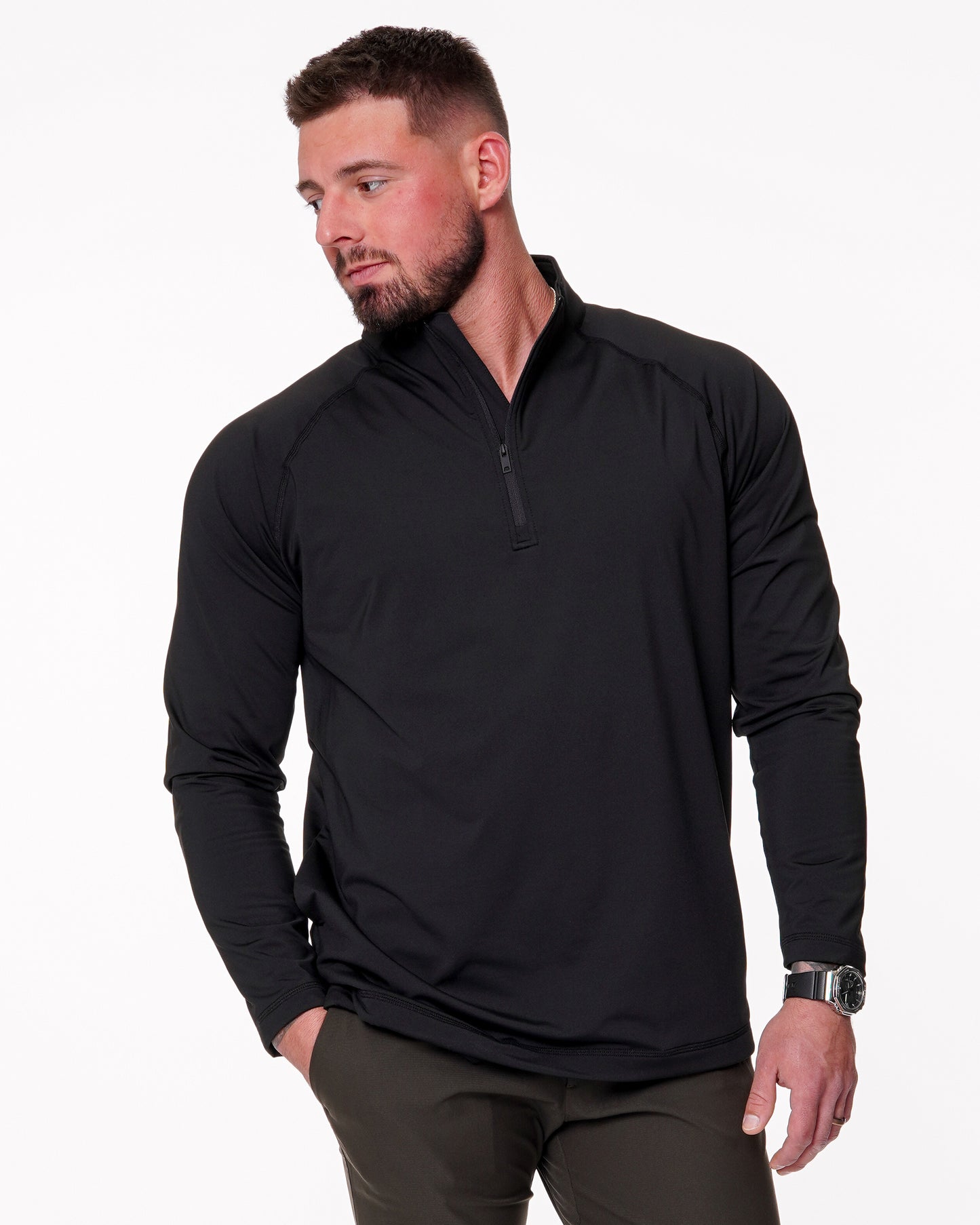 Man wearing a black quarter zip shirt