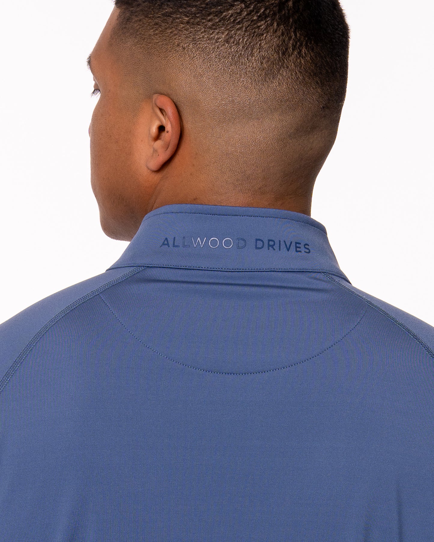 Allwood Drives logo shown on back of quarter zip collar